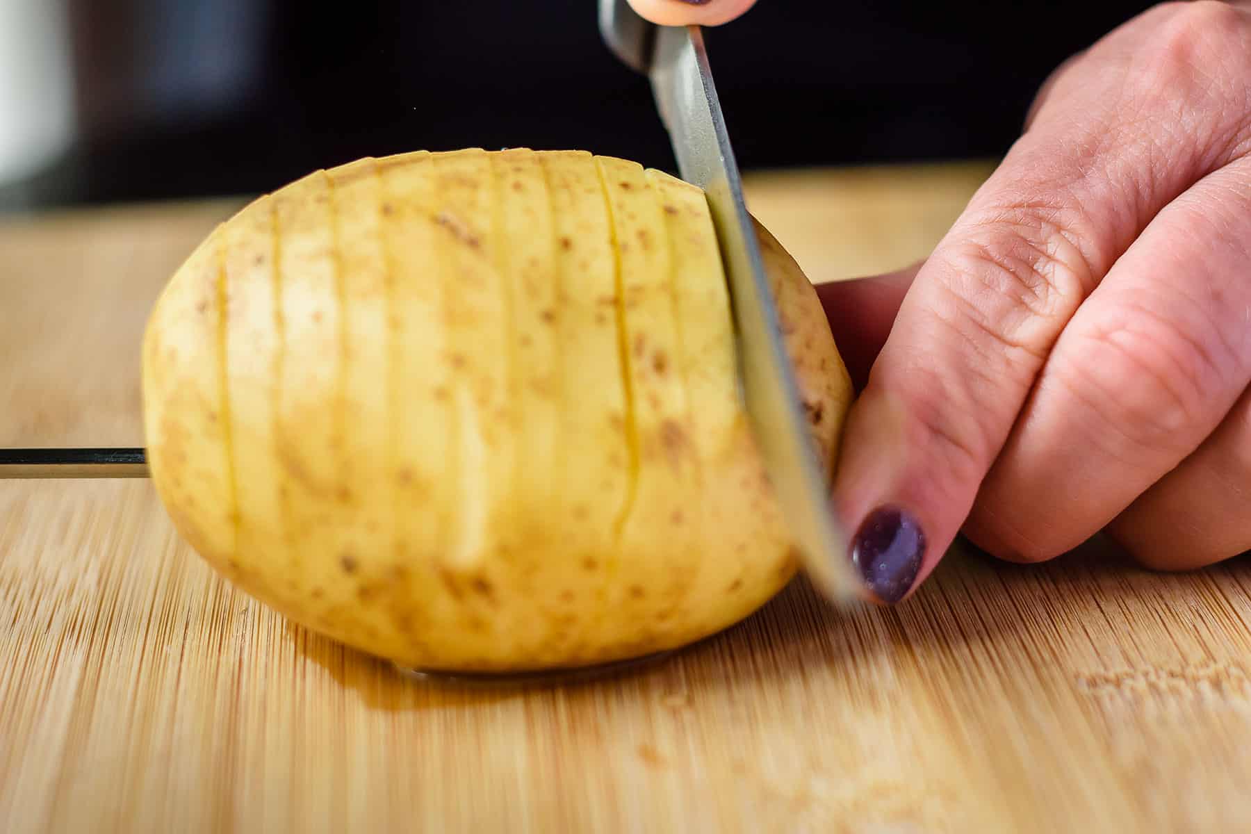 Continue slicing to other end of potato