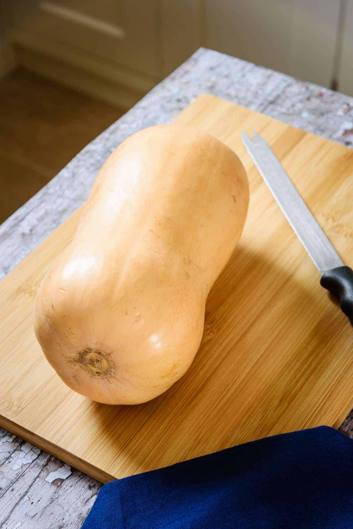 Butternut Squash on cutting board with knife