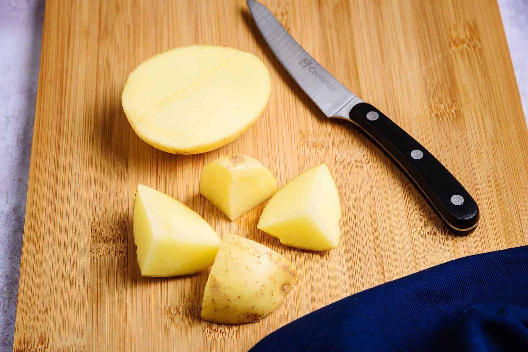 Chopped potatoes on a chopping board