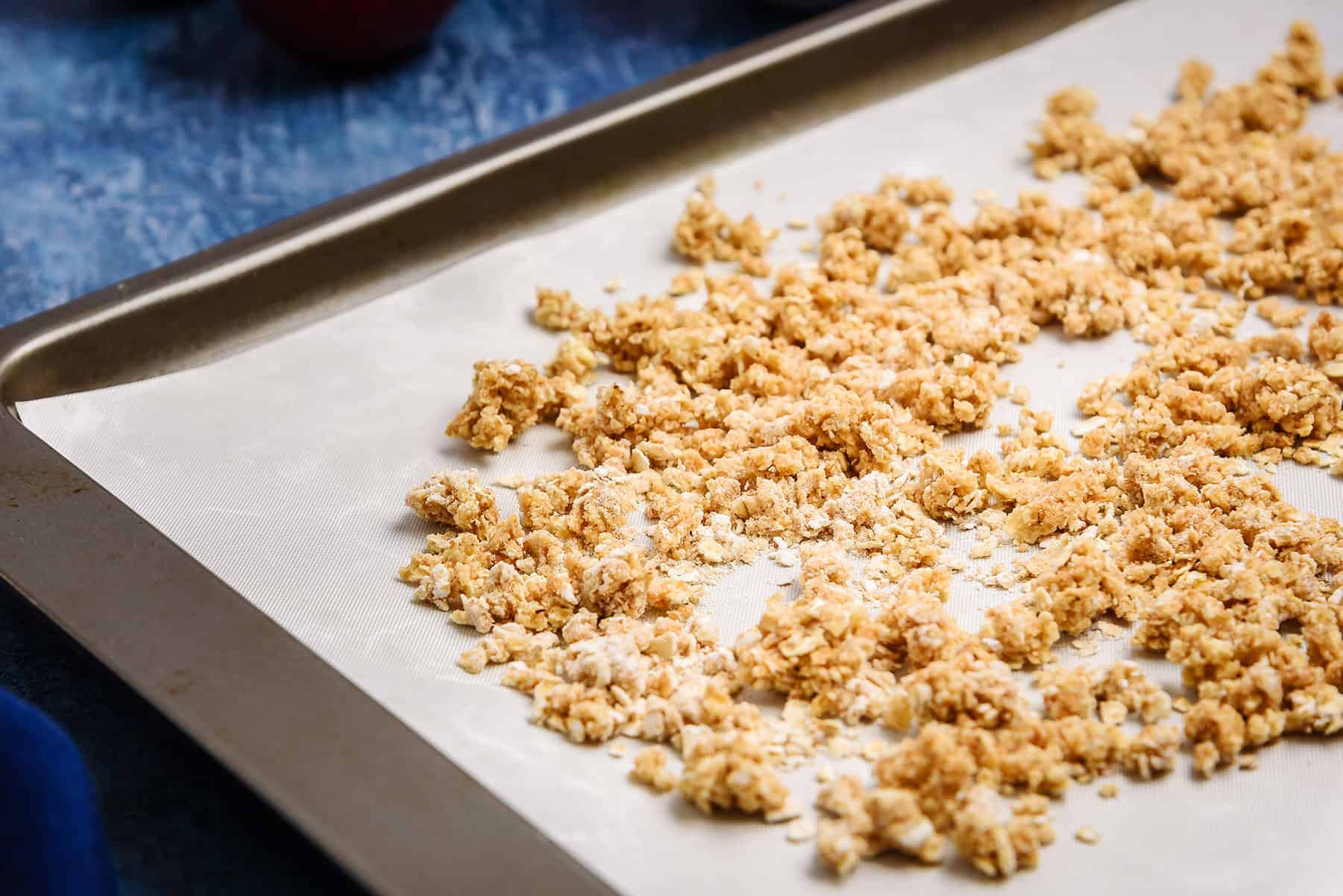 Crumble mixture on an oven tray for baking