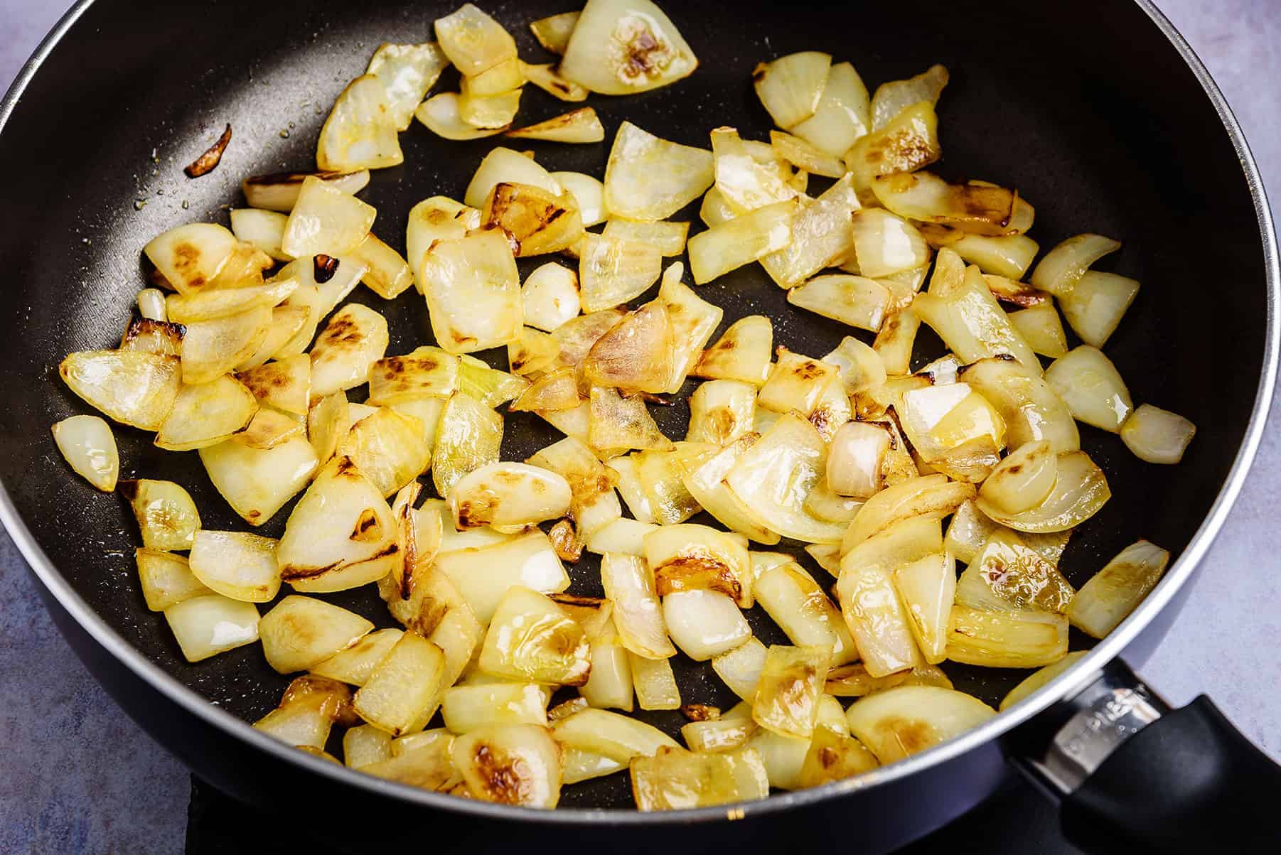 Onions frying in a pan