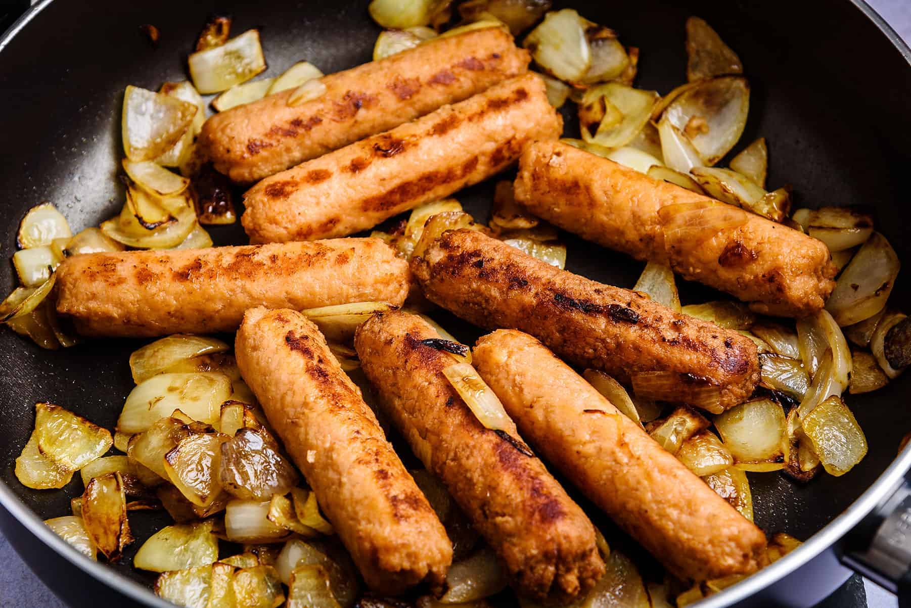Sausages and onions in pan
