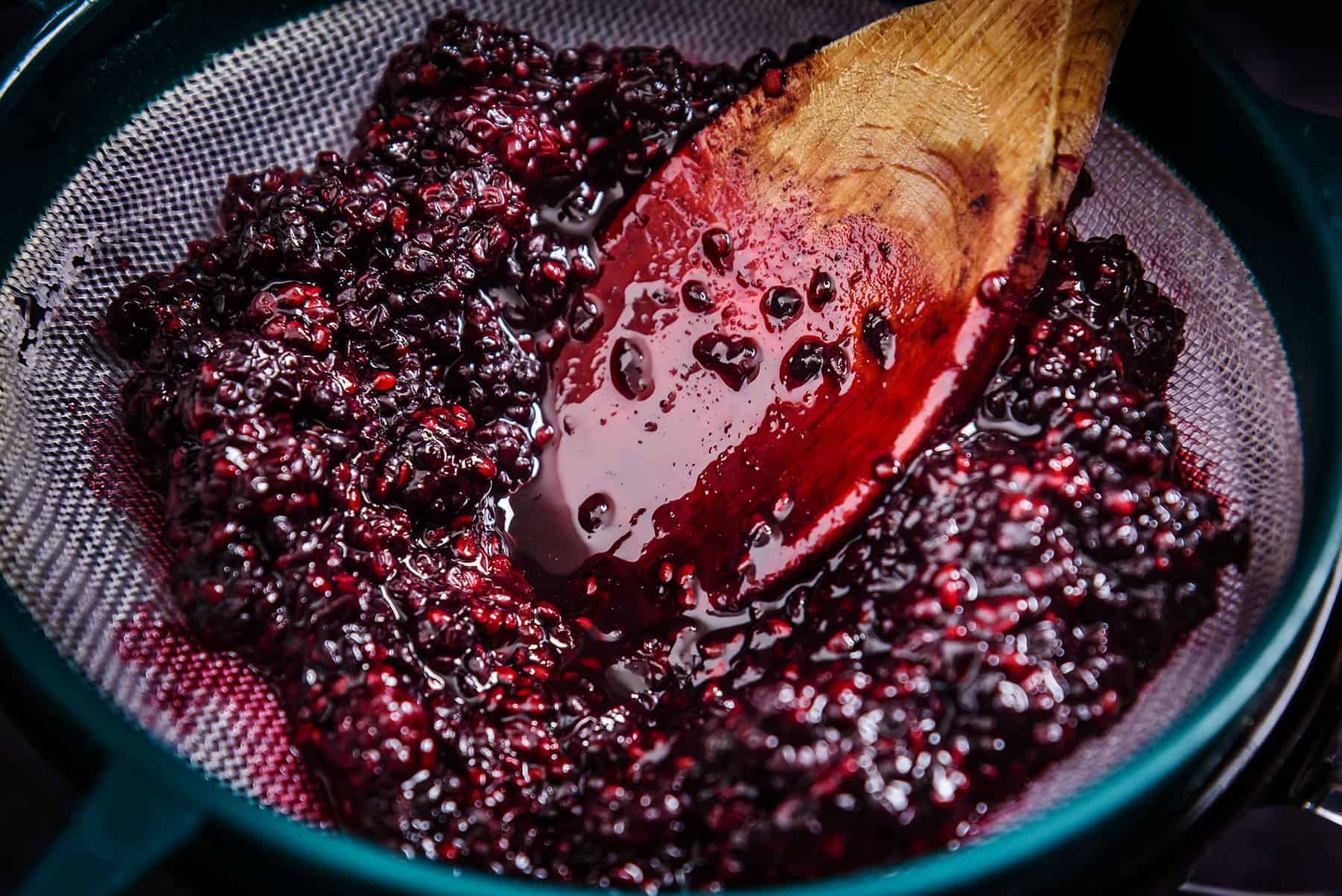 Sieving the Blackberries for Vegan Blackberry Coulis