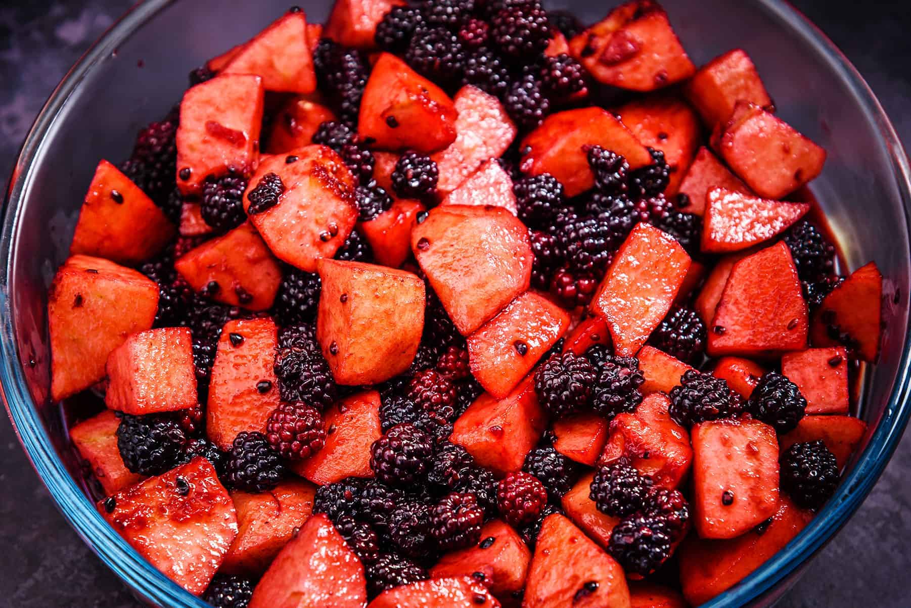 Apple and blackberry mixture in an ovenproof dish