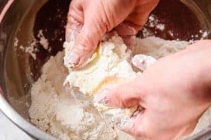 Rubbing the vegan butter into the flour