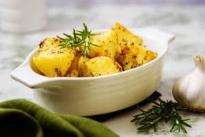 Vegan Rosemary & Garlic Roast Potatoes in a serving dish