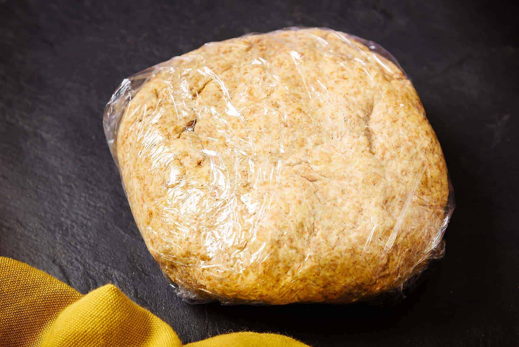 Vegan Wholemeal Shortcrust pastry dough wrapped in cling-film