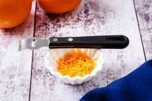 A Zesting tool with orange zest