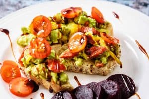 Close up of Vegan Avocado & Olive Toast-Topping on a plate