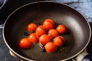 Frying the cherry tomatoes