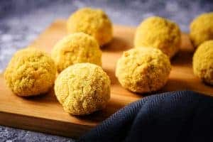 Polenta coated rice balls ready for frying