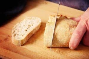 Cutting slices of bread
