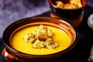 Vegan Curried Parsnip Soup topped with garlic croutons