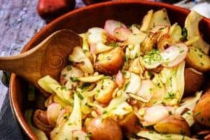 Warm Winter Potato Salad with a serving spoon