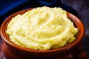 Close up of a bowl of Easy Cheesy Mashed Potatoes