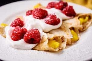 Close up of 3 filled Mango & Raspberry Cider Crepes