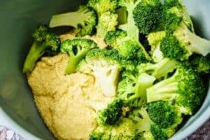 Cooked broccoli and tofu mixture in a bowl
