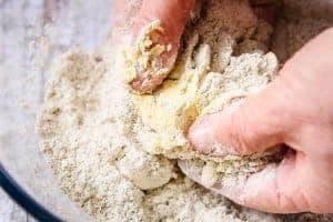 Rubbing the butter into the rye flour between fingers and thumbs