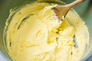 Sugar and vegan butter creamed together in a bowl
