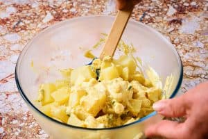 Mixing potatoes into indienne sauce